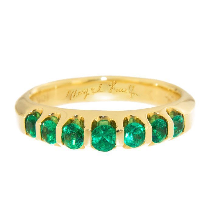 Photo of a ring with engraving inside by Emeralds International LLC.