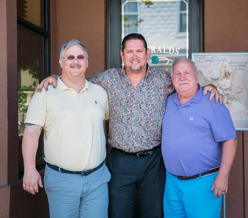 Photo of Carl with clients after working on their custom wedding bands for jay & michael.