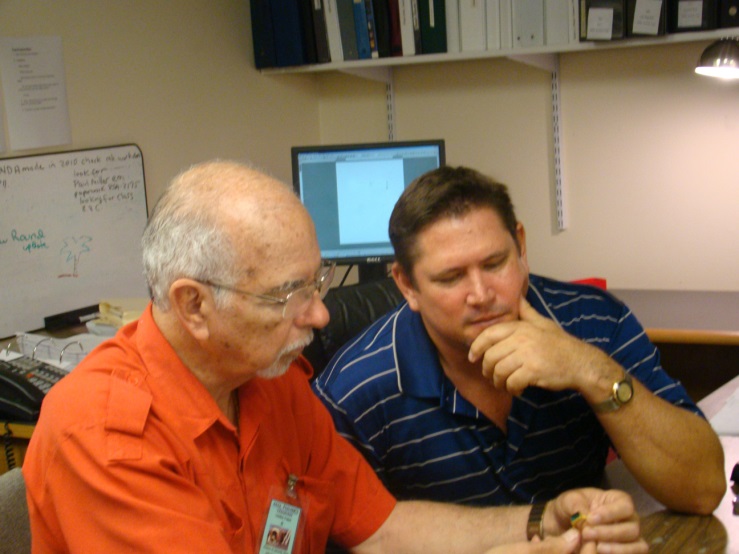 Photo of Manuel Marcial de Gomar and Carl Schutze examining the secrets of the spanish galleons