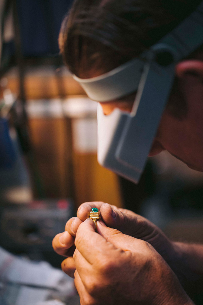 Jeweler checking emerald fit in a mudejar style ring setting
