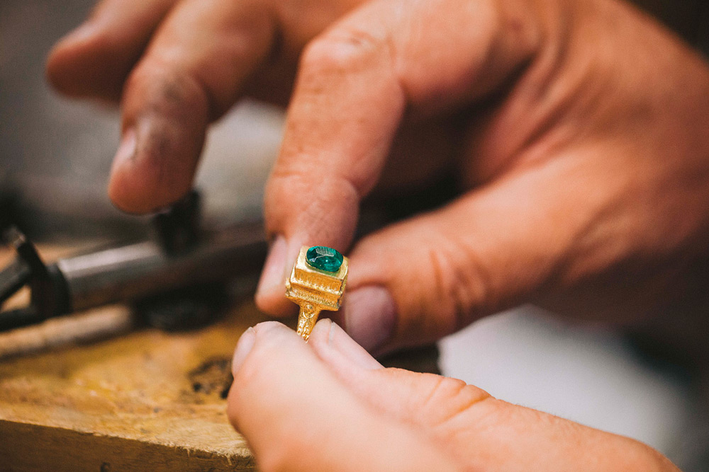 Jeweler checking emerald fit in a mudejar style ring setting