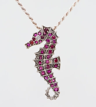 Platinum Sterling Ruby Seahorse Pendant front view.