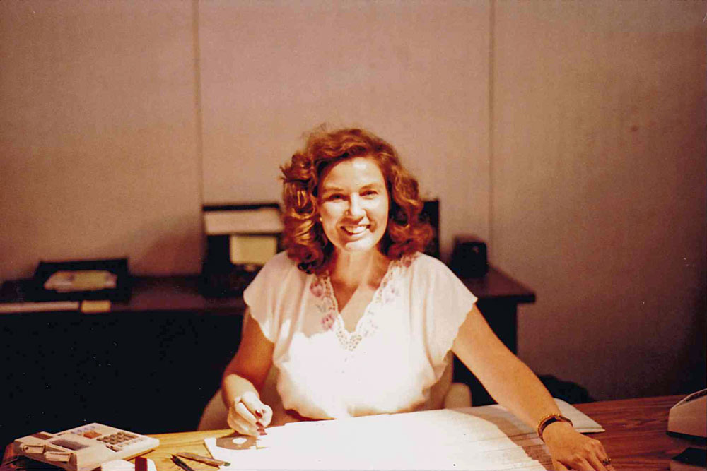 Inge Marcial working at her desk.