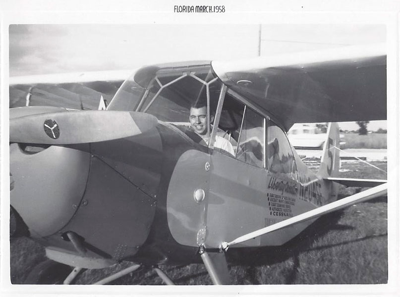 Manuel Marcial piloting an airplane in Florida in 1958