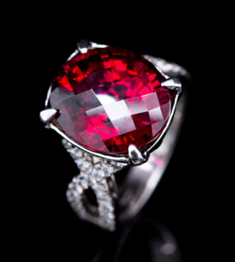 Rhodolite Garnet Ring on a black background.
