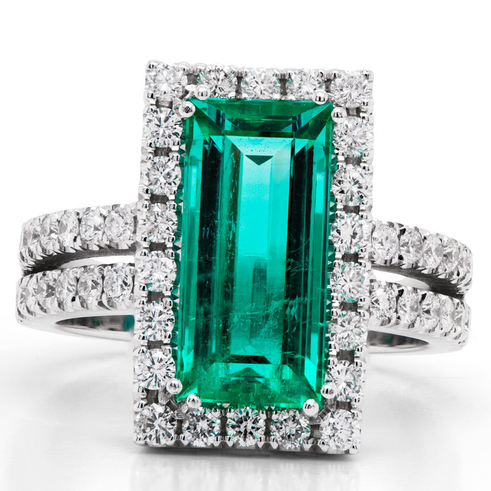 Emerald Cut Emerald & Diamond Halo Ring top view on a white background.