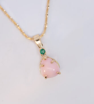 Conch pearl and emerald pendant