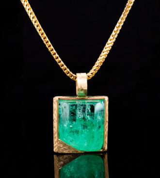 Rough terminated emerald crystal pendant