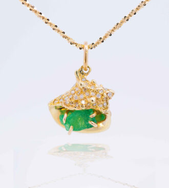 Rough emerald conch shell pendant in green gold