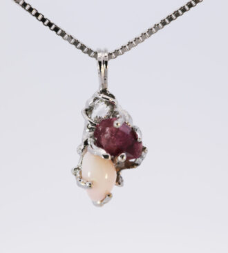 Conch pearl, diamond and red beryl pendant