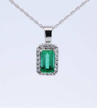 Emerald & diamond halo pendant