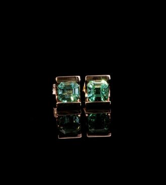 Half bezel emerald cut stud earrings