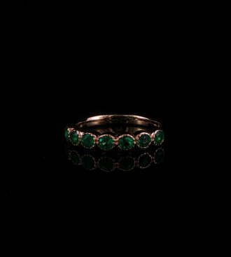Round emerald band ring
